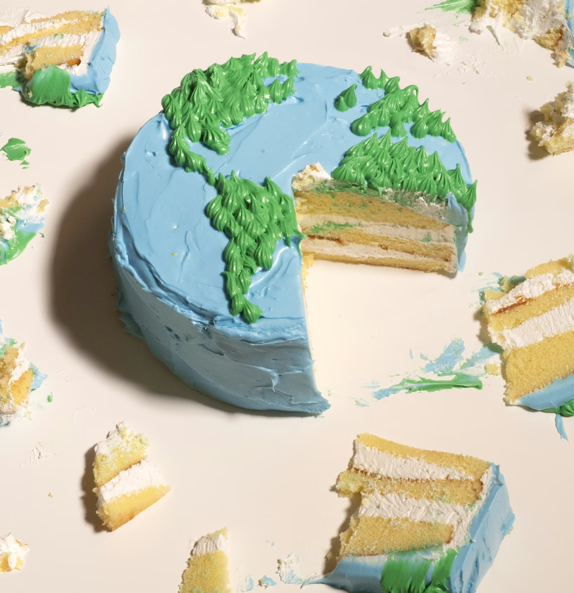 a partially eaten cake decorated to look like Earth